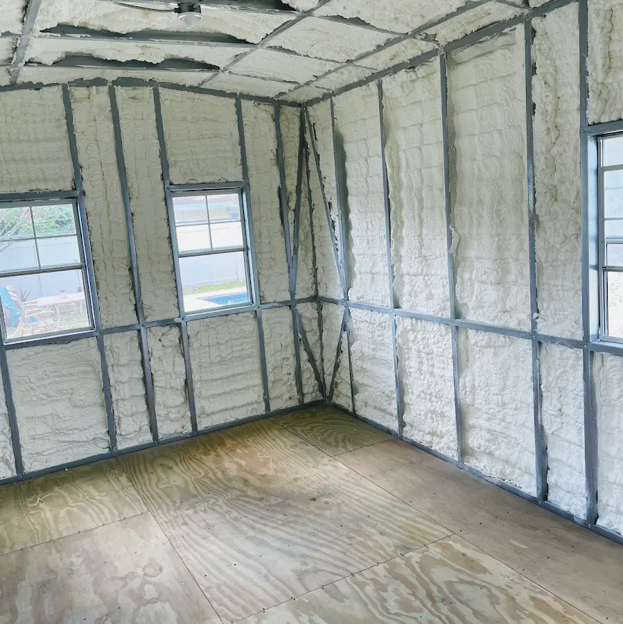 Closed-cell spray foam insulation applied to wall cavities in a residential project in Ferry Pass